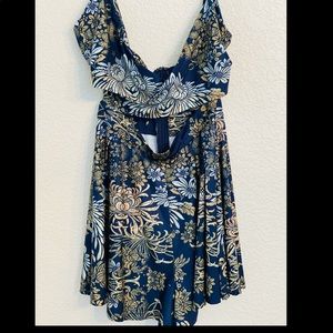 Cute romper-shorts with front cut out. Size Small.